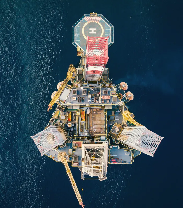 Aerial view of an offshore platform with a helipad