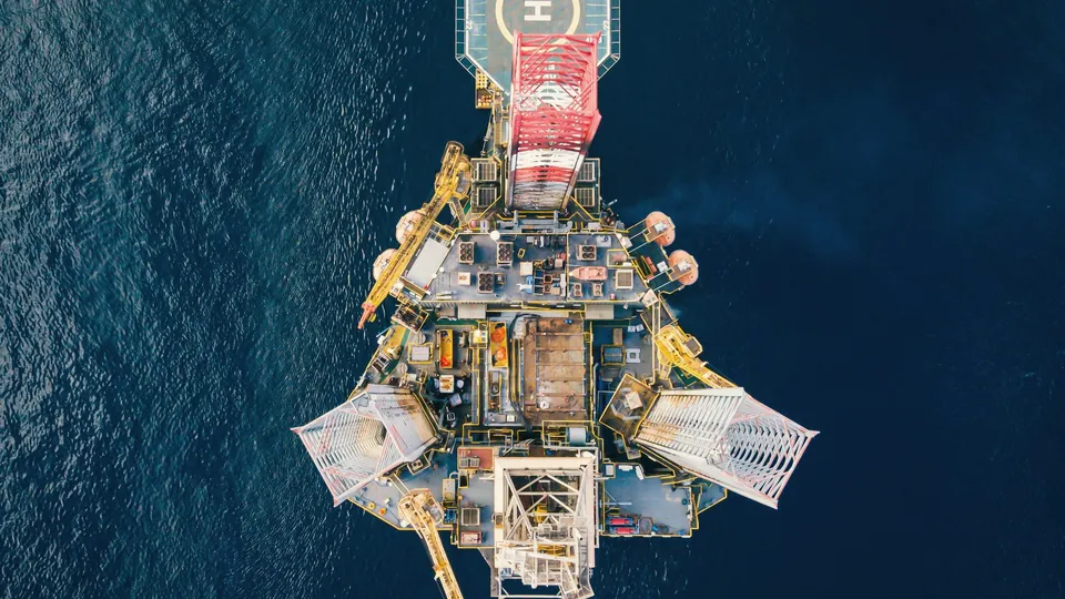 Aerial view of an offshore platform with a helipad