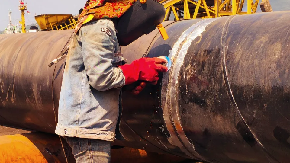 Pipeline work on a red deck