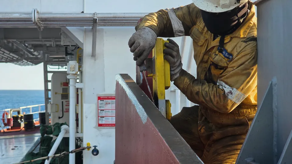Worker operating offshore rig machinery