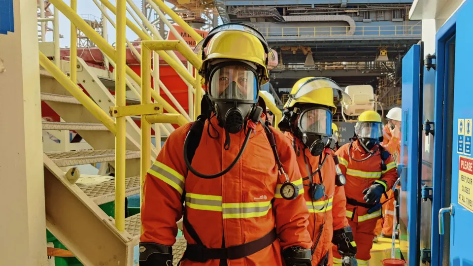 Firefighters wearing breathing masks